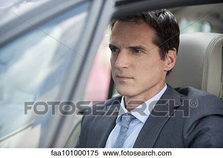 Businessman stuck in traffic View Large Photo Image Stock Photography - Businessman stuck in traffic. Fotosearch