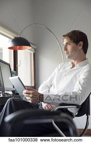 Businessman using digital tablet View Large Photo Image Stock Photo - Businessman using digital tablet. Fotosearch