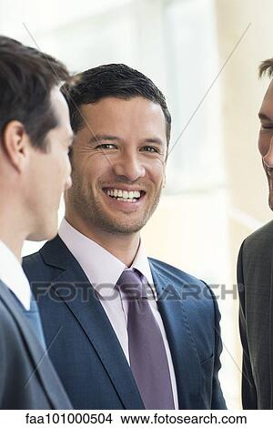 Businessmen having friendly conversation View Large Photo Image Picture - Businessmen having friendly conversation. Fotosearch