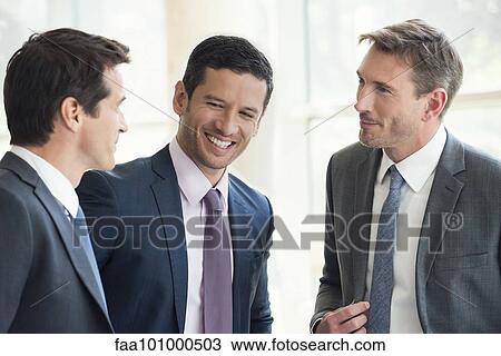 Businessmen having friendly conversation View Large Photo Image Stock Image - Businessmen having friendly conversation. Fotosearch