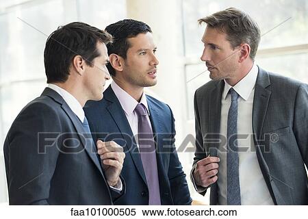 Businessmen having serious discussion View Large Photo Image Stock Photography - Businessmen having serious discussion. Fotosearch