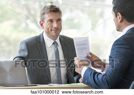 Businessmen in meeting View Large Photo Image Stock Image - Businessmen in meeting. Fotosearch