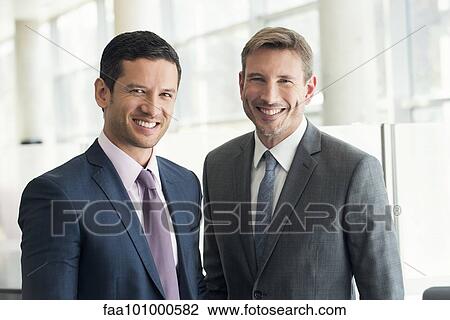"Businessmen smiling, portrait" View Large Photo Image Stock Image - "Businessmen smiling, portrait". Fotosearch