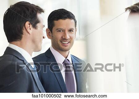 Businessmen talking together View Large Photo Image Stock Image - Businessmen talking together. Fotosearch