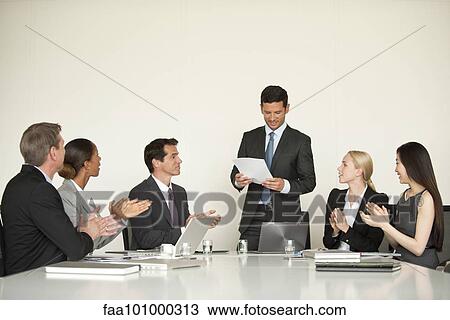 Businesspeople applauding at meeting View Large Photo Image Stock Image - Businesspeople applauding at meeting. Fotosearch