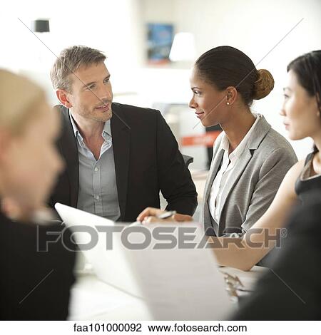 Businesspeople at meeting View Large Photo Image Stock Image - Businesspeople at meeting. Fotosearch