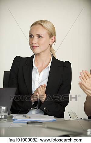 Businesswoman applauding at meeting View Large Photo Image Stock Image - Businesswoman applauding at meeting. Fotosearch