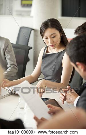 Businesswoman at corporate meeting View Large Photo Image Stock Photo - Businesswoman at corporate meeting. Fotosearch