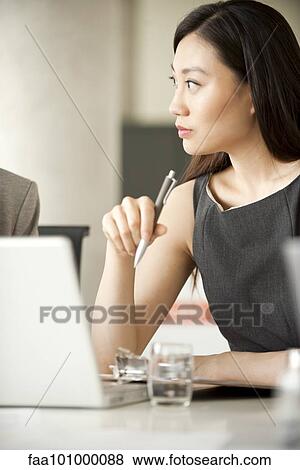 Businesswoman at meeting View Large Photo Image Stock Photo - Businesswoman at meeting. Fotosearch