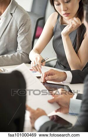 Stock Photo - Businesswoman at meeting. Fotosearch