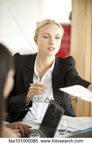 Businesswoman at meeting View Large Photo Image Stock Photography - Businesswoman at meeting. Fotosearch