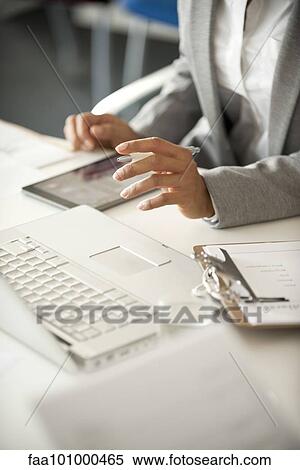 "Businesswoman using laptop computer, cropped" View Large Photo Image Stock Photography - "Businesswoman using laptop computer, cropped". Fotosearch