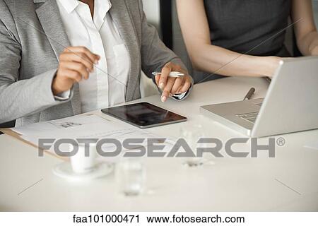 Businesswomen collaborating View Large Photo Image Stock Image - Businesswomen collaborating. Fotosearch