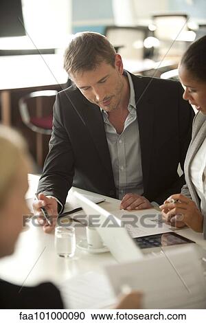Colleagues working together View Large Photo Image Stock Image - Colleagues working together. Fotosearch