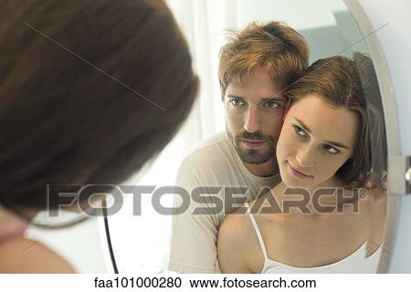 "Couple cheek to cheek, looking at each other in mirror" View Large Photo Image Stock Image - "Couple cheek to cheek, looking at each other in mirror". Fotosearch