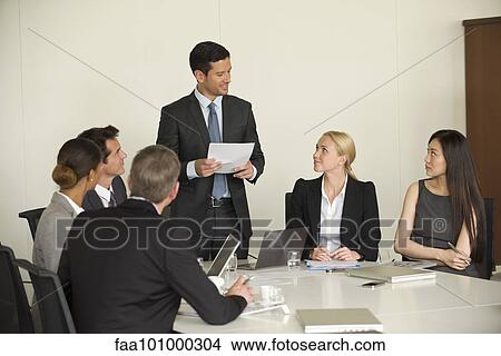 Executive giving presentation in meeting View Large Photo Image Picture - Executive giving presentation in meeting. Fotosearch