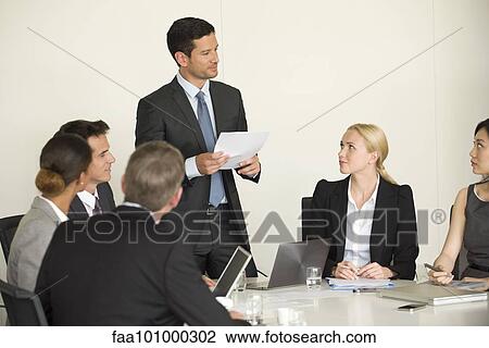 Executive giving presentation in meeting View Large Photo Image Stock Image - Executive giving presentation in meeting. Fotosearch