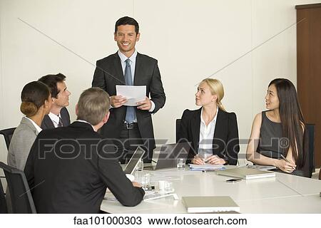 Executive giving presentation in meeting View Large Photo Image Stock Image - Executive giving presentation in meeting. Fotosearch
