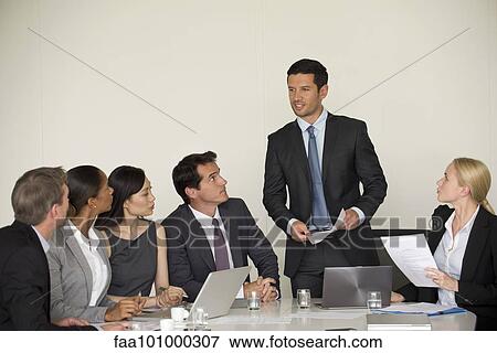 Executive giving presentation in meeting View Large Photo Image Stock Photo - Executive giving presentation in meeting. Fotosearch