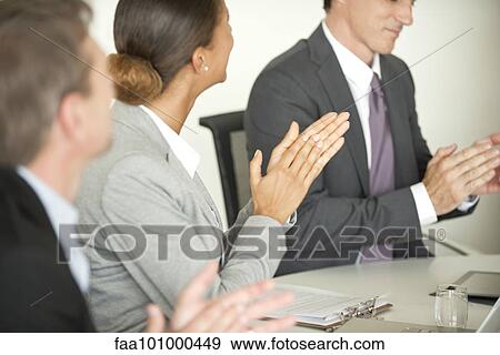 Executives clapping in meeting View Large Photo Image Stock Photo - Executives clapping in meeting. Fotosearch