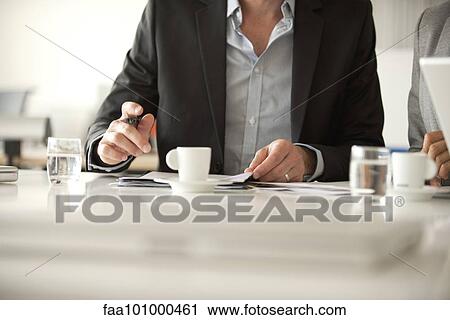 "Executives in meeting, cropped" View Large Photo Image Stock Image - "Executives in meeting, cropped". Fotosearch