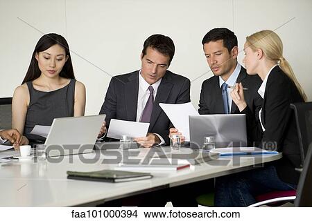 Executives in meeting View Large Photo Image Picture - Executives in meeting. Fotosearch