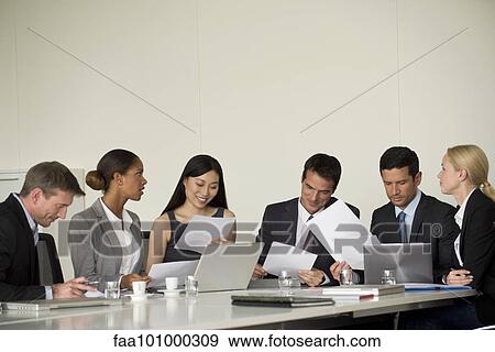 Stock Photo - Executives in meeting. Fotosearch