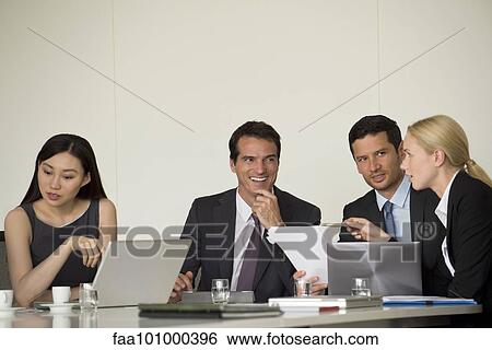 Stock Photograph - Executives in meeting. Fotosearch