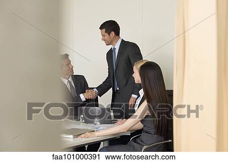 "Executives meeting in conference room, viewed through doorway" View Large Photo Image Stock Image - "Executives meeting in conference room, viewed through doorway". Fotosearch