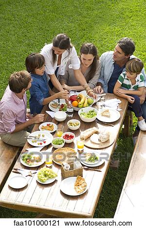 Family and friends gather for vacation picnic View Large Photo Image Stock Image - Family and friends gather for vacation picnic. Fotosearch