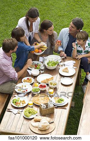 Family and friends gather for weekend picnic View Large Photo Image Stock Image - Family and friends gather for weekend picnic. Fotosearch