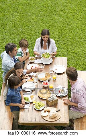 Family and friends gather for weekend picnic View Large Photo Image Stock Photograph - Family and friends gather for weekend picnic. Fotosearch