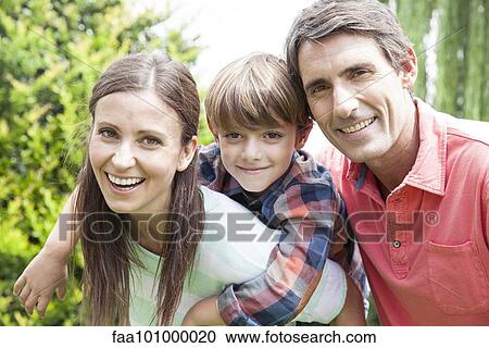 Stock Image - "Family with one child, portrait". Fotosearch