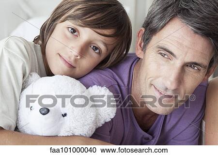 "Father and young boy, portrait" View Large Photo Image Stock Image - "Father and young boy, portrait". Fotosearch
