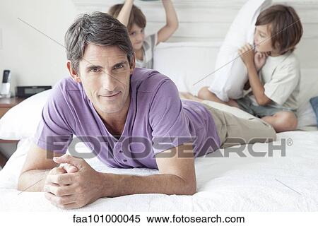 "Father with young boys, portrait" View Large Photo Image Stock Photography - "Father with young boys, portrait". Fotosearch