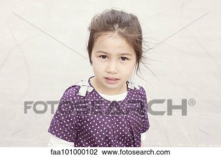 Stock Image - "Little girl outdoors, portrait". Fotosearch