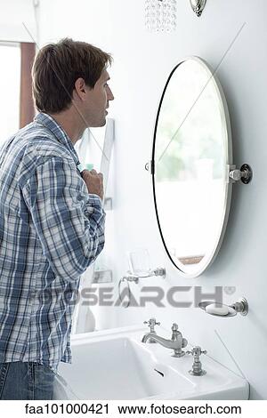 Man buttoning shirt View Large Photo Image Stock Image - Man buttoning shirt. Fotosearch
