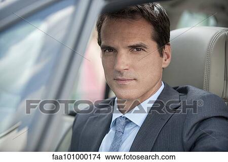 Picture - Man driving car. Fotosearch