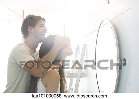 Man surprising girlfriend View Large Photo Image Stock Photo - Man surprising girlfriend. Fotosearch