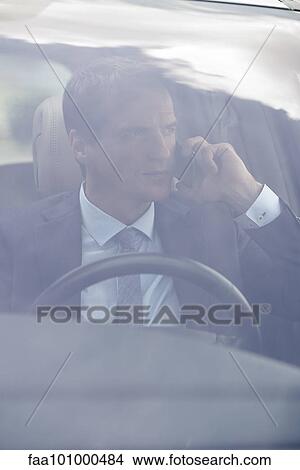 Man talking on cell phone while driving View Large Photo Image Picture - Man talking on cell phone while driving. Fotosearch