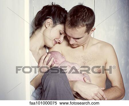 New parents sitting with newborn baby View Large Photo Image Stock Photography - New parents sitting with newborn baby. Fotosearch