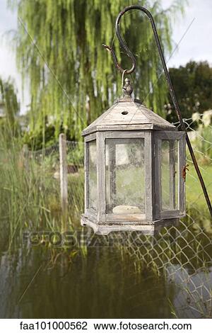 Old-fashioned lantern hanging over lake View Large Photo Image Stock Image - Old-fashioned lantern hanging over lake. Fotosearch