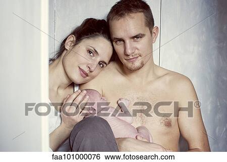 "Parents holding newborn baby, portrait" View Large Photo Image Stock Photograph - "Parents holding newborn baby, portrait". Fotosearch
