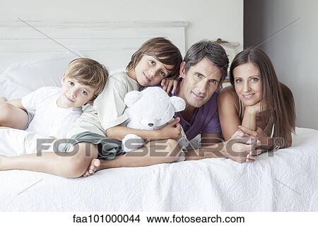 "Parents with young boys, portrait" View Large Photo Image Picture - "Parents with young boys, portrait". Fotosearch