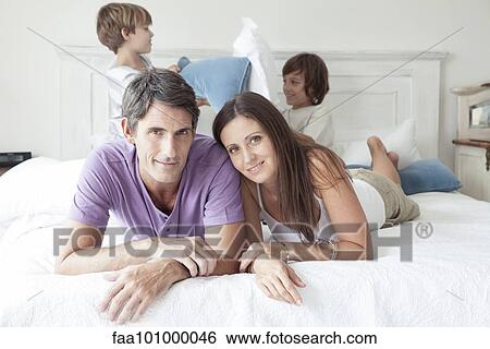 "Parents with young boys, portrait" View Large Photo Image Stock Photograph - "Parents with young boys, portrait". Fotosearch