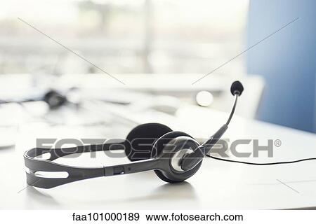 Stock Photo - Phone headset on desk. Fotosearch