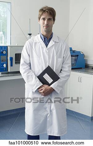 Stock Image - "Scientist standing in laboratory, portrait". Fotosearch
