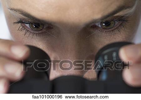 Stock Photograph - "Scientist using microscope, close-up". Fotosearch