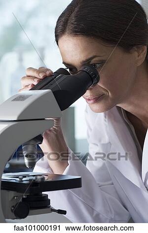 Scientist using microscope in laboratory View Large Photo Image Stock Image - Scientist using microscope in laboratory. Fotosearch