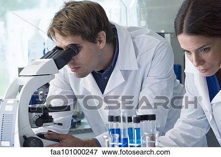 Scientists working in laboratory View Large Photo Image Stock Photo - Scientists working in laboratory. Fotosearch
